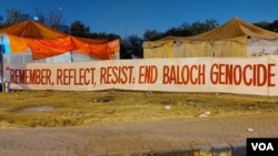 Activists' banner is displayed near the Islamabad press club, Dec. 20, 2023. (Malik Waqar Ahmed/VOA) 