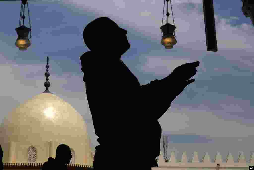 A man prays during the Muslims holy fasting month of Ramadan at Amr ibn al-Aas Mosque in Cairo, Egypt.