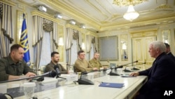 Ukrainian President Volodymyr Zelenskyy, second left, listens to former U.S. Vice President Mike Pence, right, during their meeting in Kyiv, Ukraine, June 29, 2023. (Ukrainian Presidential Press Office via AP)