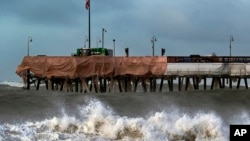 FILE - Large waves crash along the Southern California coast near the Ventura Pier in Ventura, Calif. on Dec. 30, 2023.