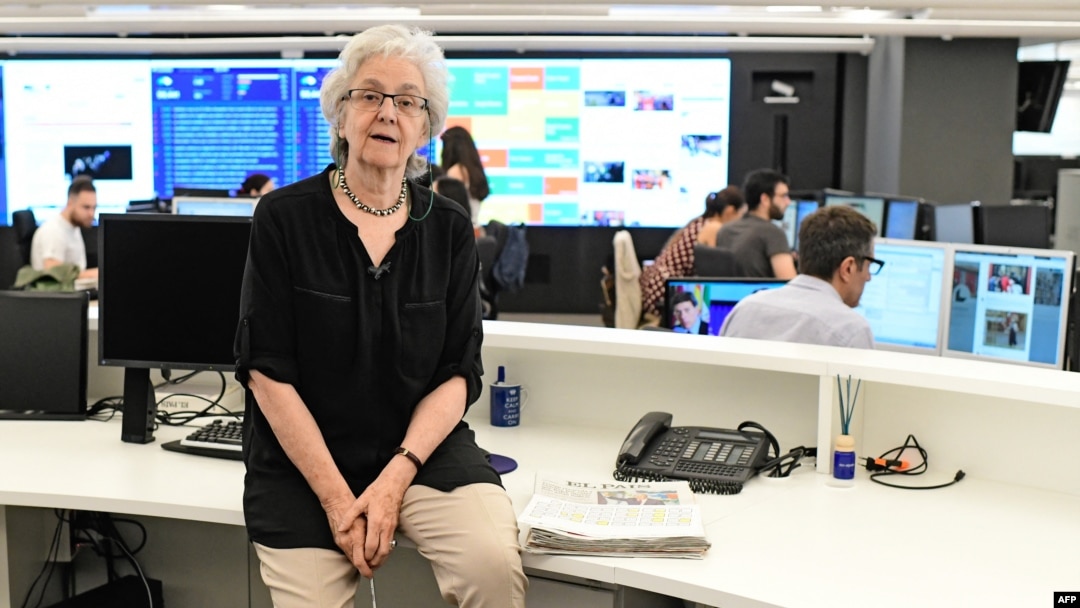 FILE - Soledad Gallego-Diaz, then the editor-in-chief of the Spanish daily newspaper El Pais, is seen in a newsroom in Madrid, July 3, 2018