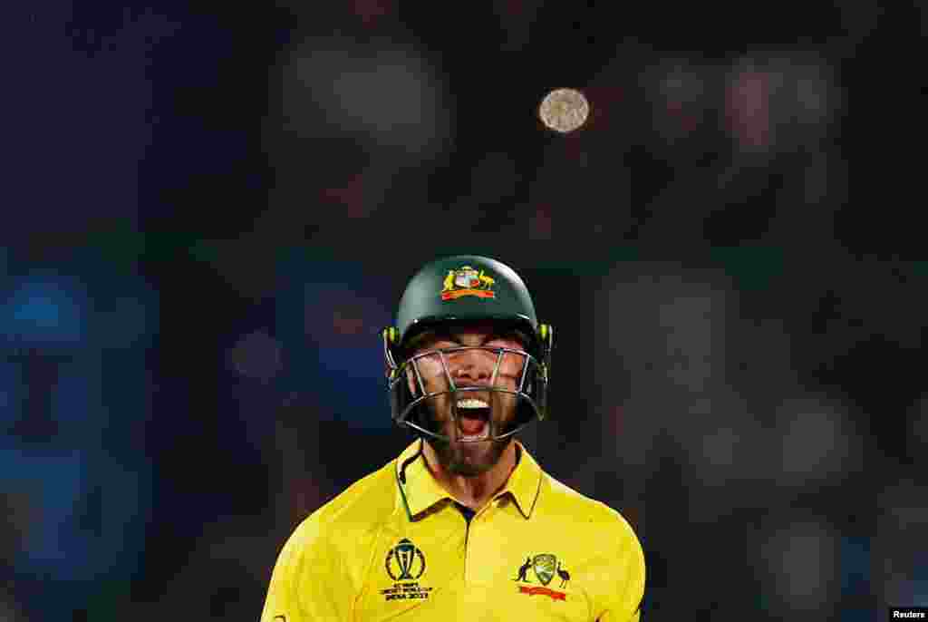 Australia's Glenn Maxwell celebrates after scoring a century (100 runs) during the 2023 ICC Men's Cricket World Cup one-day international match between Australia and Netherlands at the Arun Jaitley Stadium in New Delhi.