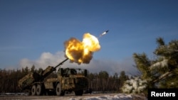 FILE - A Swedish-made Archer self-propelled howitzer of Ukraine’s 45th separate artillery brigade fires at Russian positions in the Donetsk region, Dec. 16, 2023.