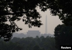 The Washington Monument and Lincoln Memorial are shrouded in smoky skies from the Canadian wildfires, bringing code red air quality conditions in Washington, June 29, 2023.