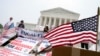 People protest outside of the Supreme Court in Washington, Thursday, June 29, 2023. 