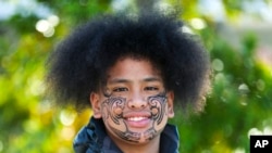 Perceus Samuels smiles after having his face painted during Matariki Whanau Day at the Wainuiomata Community Hub, Wellington, New Zealand, on June 22, 2024. 
