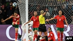 Moroccan players express disgruntlement after referee Tori Penso validated a goal scored by German forward Alexandra Popp in the 39th minute of their opening Group H 2023 FIFA Women's World Cup clash held in Melbourne, Australia, July 24, 2023. 