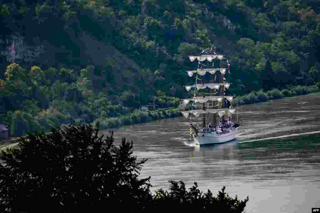 The Mexican three-mast full-rigged ship Cuauhtemoc sails the Seine River to reach the Armada gathering of old vessels and tall ships in Rouen.