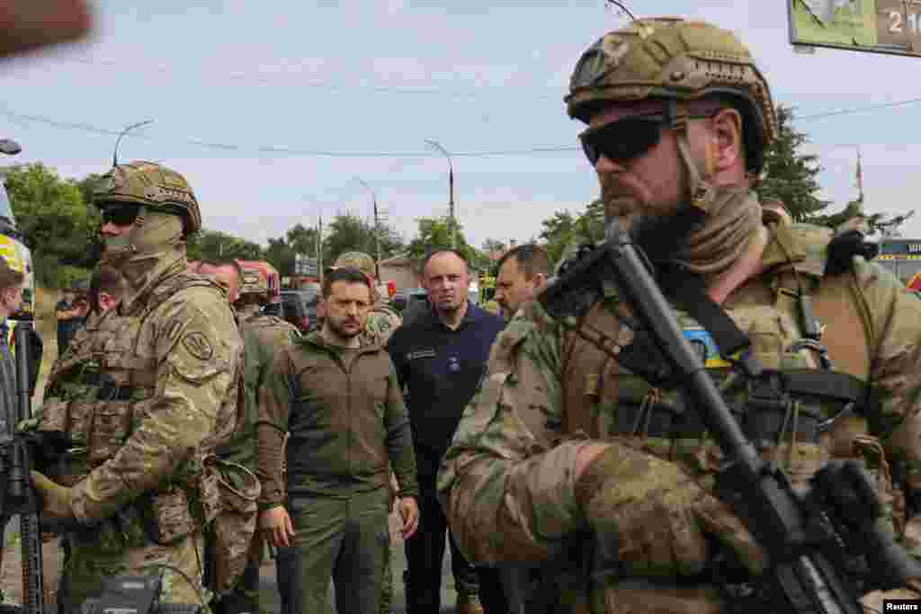 Ukraine&#39;s President Volodymyr Zelenskiy visits a flooded area after the Nova Kakhovka dam breached, in Kherson, June 8, 2023.