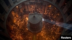 عکس آرشیوی: برگزاری یکی از آیین‌های مذهبی مسیحیان در کلیسای مقبره مقدس در سال‌های گذشته