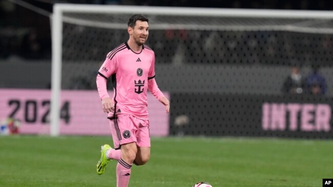 Inter Miami's Lionel Messi controls the ball during the friendly soccer match between Vissel Kobe and Inter Miami CF at the National Stadium, Feb. 7, 2024, in Tokyo.