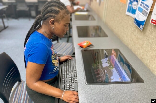 Oryanan Lewis works in the computer lab at Chattahoochee Valley Community College in Phenix City, Ala., on Feb. 23, 2023. (Rebecca Griesbach/AL.com/Press-Register via AP)