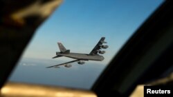 FILE - A B-52 long-range bomber is seen March 28, 2019. (Courtesy Tessa B. Corrick/U.S. Air Force/Handout via Reuters)