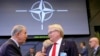 FILE - Turkish Defense Minister Hulusi Akar, left, speaks with Sweden's Defense Minister Peter Hultqvist during a meeting of the North Atlantic Council in defense ministers format at NATO headquarters in Brussels, Oct. 13, 2022.