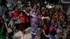 Supporters of Bilawal Bhutto Zardari, chairman of Pakistan People's Party, dance to celebrate their party victory in initial results of the country's parliamentary election in Karachi, Pakistan, Feb. 9, 2024.