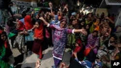 Supporters of Bilawal Bhutto Zardari, chairman of Pakistan People's Party, dance to celebrate their party victory in initial results of the country's parliamentary election in Karachi, Pakistan, Feb. 9, 2024.