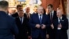 In this photo provided by the Belarusian Presidential Press Service, Belarusian President Alexander Lukashenko, center, walks ahead of voting at a polling station in Minsk, Belarus, Feb. 25, 2024.