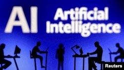 FILE - Figurines with computers and smartphones are seen in front of the words "Artificial Intelligence AI" in this illustration taken, February 19, 2024. (REUTERS/Dado Ruvic/Illustration/File Photo)