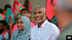 Maldives' main opposition candidate Mohamed Muiz participates in a rally as he concludes his campaign for the second round of presidential election in capital of Male, Sept.29, 2023. 