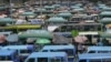 FILE - Kenyan public transport, known locally as matatu, queue to transport passengers in Nairobi, Sept. 12, 2023. 