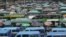 FILE - Kenyan public transport, known locally as matatu, queue to transport passengers in Nairobi, Sept. 12, 2023. 