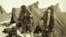 FILE - British mountaineers George Mallory is seen with Andrew Irvine at the base camp in Nepal, both members of the Mount Everest expeditions 1922 and 1924, as they get ready to climb the peak of Mount Everest, June 1924. 