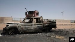 A destroyed military vehicle is seen in Khartoum, Sudan, April 20, 2023.