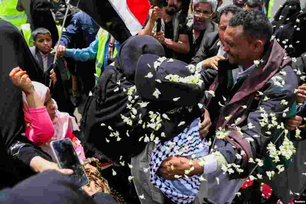 Freed Houthi activist Samira Marish is greeted after arriving on an International Committee of the Red Cross (ICRC)-chartered plane at Sanaa Airport, in Sanaa.