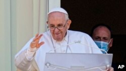 FILE - In this file photo dated July 11, 2021, Pope Francis appears on a balcony of the Agostino Gemelli Polyclinic in Rome. 