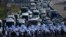 FILE - Israeli protesters block the Tel Aviv-Haifa highway near Beit Yanai, Israel, during a protest against plans by Prime Minister Benjamin Netanyahu's new government to overhaul the judicial system, July 11, 2023. 