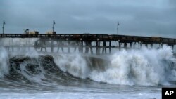 FILE - Large waves crash along the Southern California coast near the Ventura Pier in Ventura, Calif., on Dec. 30, 2023.