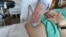 FILE - A doctor performs an ultrasound scan on a pregnant woman on Aug. 7, 2018, at a hospital in Chicago.