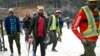 Rescue personnel arrive for manual drilling at a collapsed under-construction road tunnel Uttarkashi, state of Uttarakhand, in northern India, Nov. 27, 2023. The collapse on Nov. 12 trapped 41 workers inside.