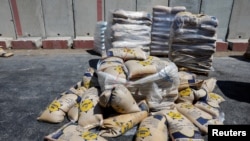 Aid destined for the Gaza Strip sits at the Kerem Shalom crossing in southern Israel, July 10, 2024.