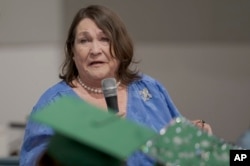 Kitty Sibley Morrison, principal and founder of the Springfield Preparatory School, speaks during a graduation ceremony of the school at Victory in Christ church in Holden, La., Saturday, Aug. 5, 2023. (AP Photo/Matthew Hinton)