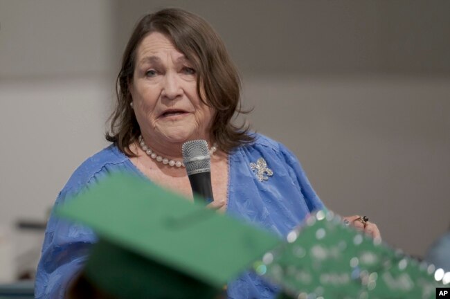 Kitty Sibley Morrison, principal and founder of the Springfield Preparatory School, speaks during a graduation ceremony of the school at Victory in Christ church in Holden, La., Saturday, Aug. 5, 2023. (AP Photo/Matthew Hinton)