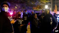 Protesters cheer outside the Democratic National Committee headquarters Nov. 15, 2023, in Washington.