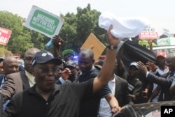 Atiku Abubakar of the Peoples Democratic Party greets supporters at a protest against election results, in Abuja, Nigeria, March 6, 2023.