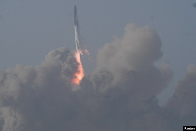 Huge smoke clouds form as SpaceX Starship raises from the company's Boca Chica launchpad on an orbital test mission near Brownsville, Texas, U.S. April 20, 2023. (REUTERS/Gene Blevins)