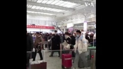 一些春运返乡探亲的中国打工族谈过去一年的经济状况 