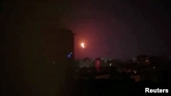 A Russia-launched drone is seen exploding in the night sky after being intercepted over Kyiv, Ukraine, July 2, 2023, in this screengrab from video.