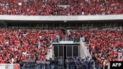 Members of the South African Police Services stand guard during at the Economic Freedom Fighters manifesto launch at the Moses Mabhida stadium in Durban, South Africa, Feb. 10, 2024.