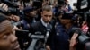 FILE - Oscar Pistorius leaves the High Court in Pretoria, South Africa, Tuesday June 14, 2016 during his trail for the murder of girlfriend Reeva Steenkamp.