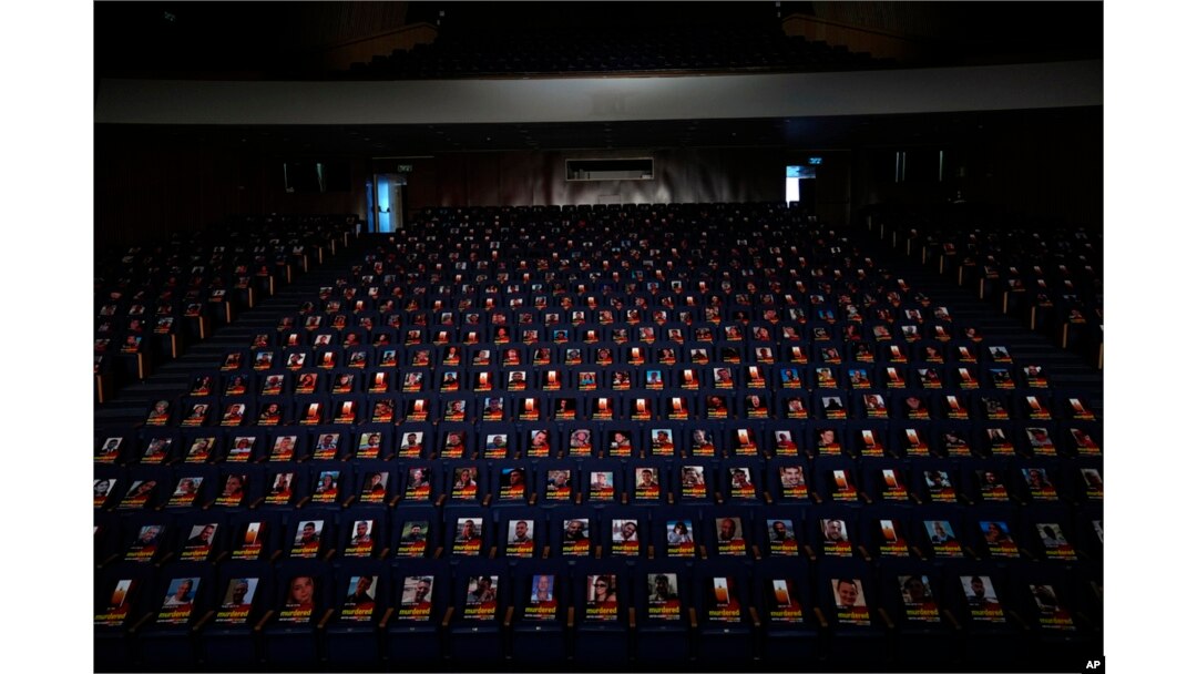 FILE - Photographs of over 1,000 persons killed, missing or abducted in the Hamas attack on Israel on October 7 are displayed on empty seats in an exhibit in the Smolarz Auditorium at Tel Aviv University, Oct. 22, 2023.