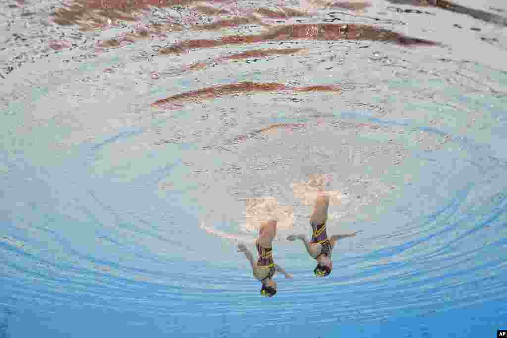 Thea Grima Buttigieg and Emily Ruggier of Malta compete in the women's duet technical of artistic swimming at the World Aquatics Championships in Doha, Qatar.