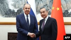 د چین او روس د بهرنیو چارو د وزیرانو دا انځور د فرانس پریس خبري ادارې خپور کړی.