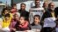 Palestinian men and children gather for a demonstration in Rafah in the southern Gaza Strip on Jan. 30, 2024, calling for continued international support to the United Nations Relief and Works Agency for Palestine Refugees in the Near East (UNRWA).