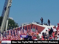 Snipers berdiri di atap gedung saat kampanye mantan Presiden AS Donald Trump di Butler, Pennsylvania, AS, 13 Juli 2024. (Foto: Glen Van Tryfle/TMX via REUTERS)