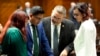 From left, Democratic Arizona Reps. Melody Hernandez, Oscar De Los Santos, Lupe Contreras and Nancy Gutierrez confer, April 17, 2024, at the Capitol in Phoenix. House Republicans again blocked an effort to repeal a near-total ban on abortions.