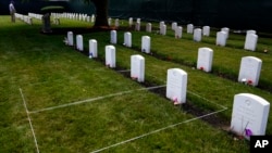 FILE - Headstones are seen at the cemetery of the US Army's Carlisle Barracks, June 10, 2022, in Carlisle, Pa. 